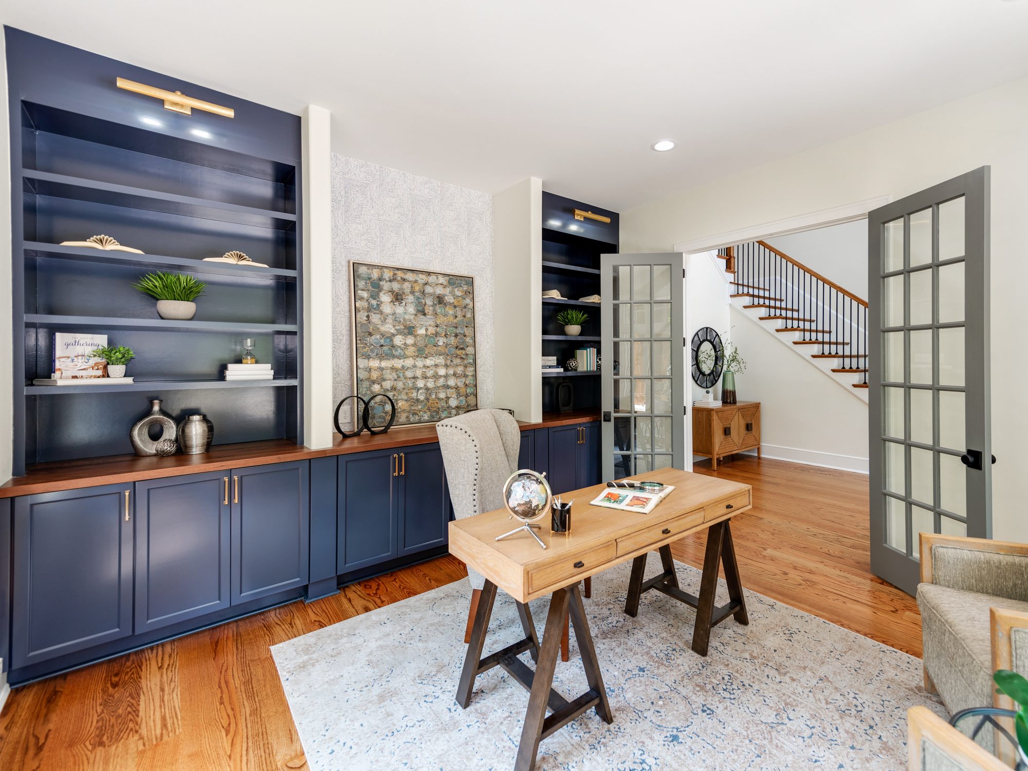 Office detail with paneled walls and library shelving — Brantham by Stillman Properties Charlotte NC