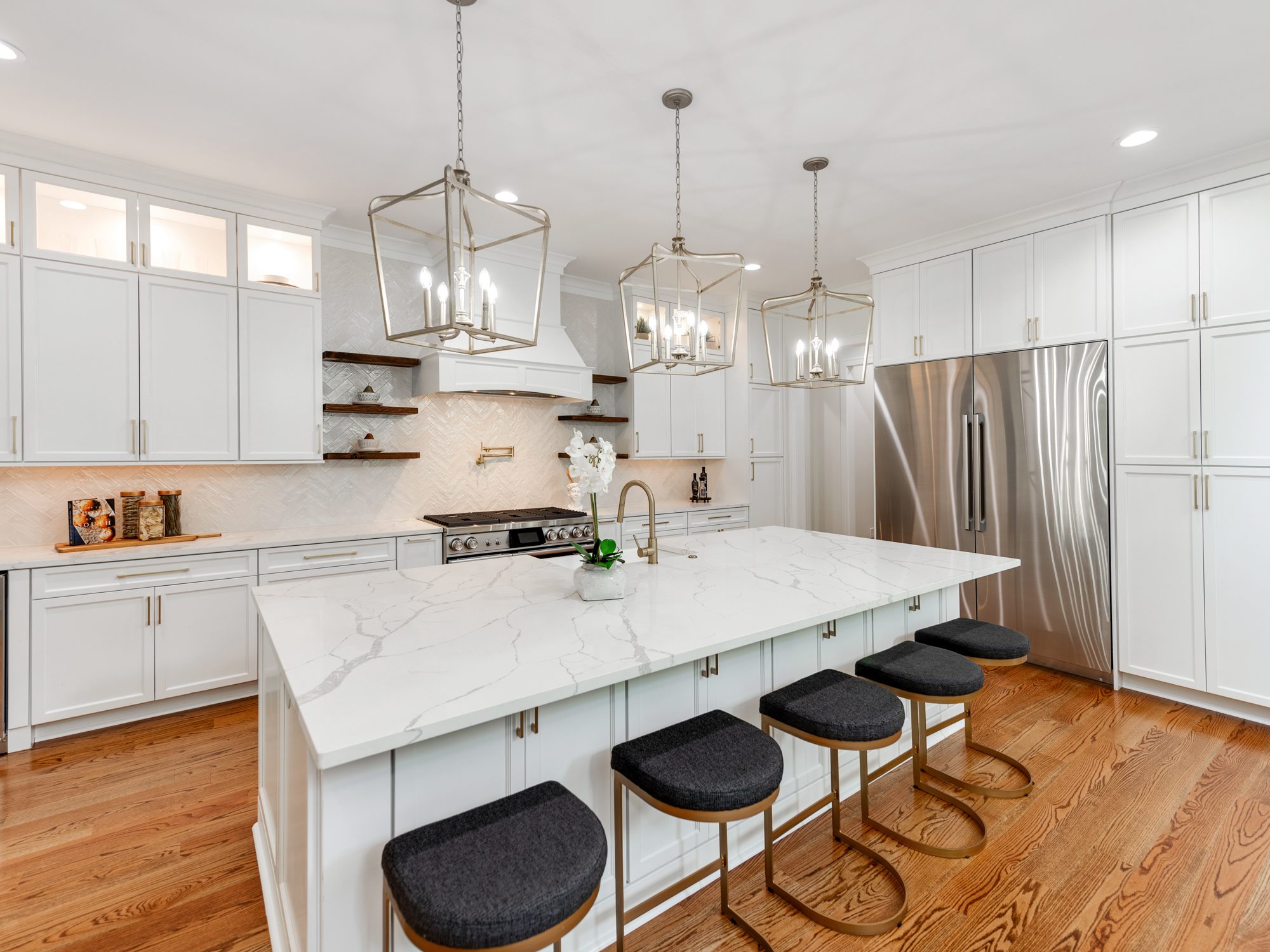 Kitchen island from the opposite angle showing range wall and open shelving — Brantham by Stillman Properties Charlotte NC