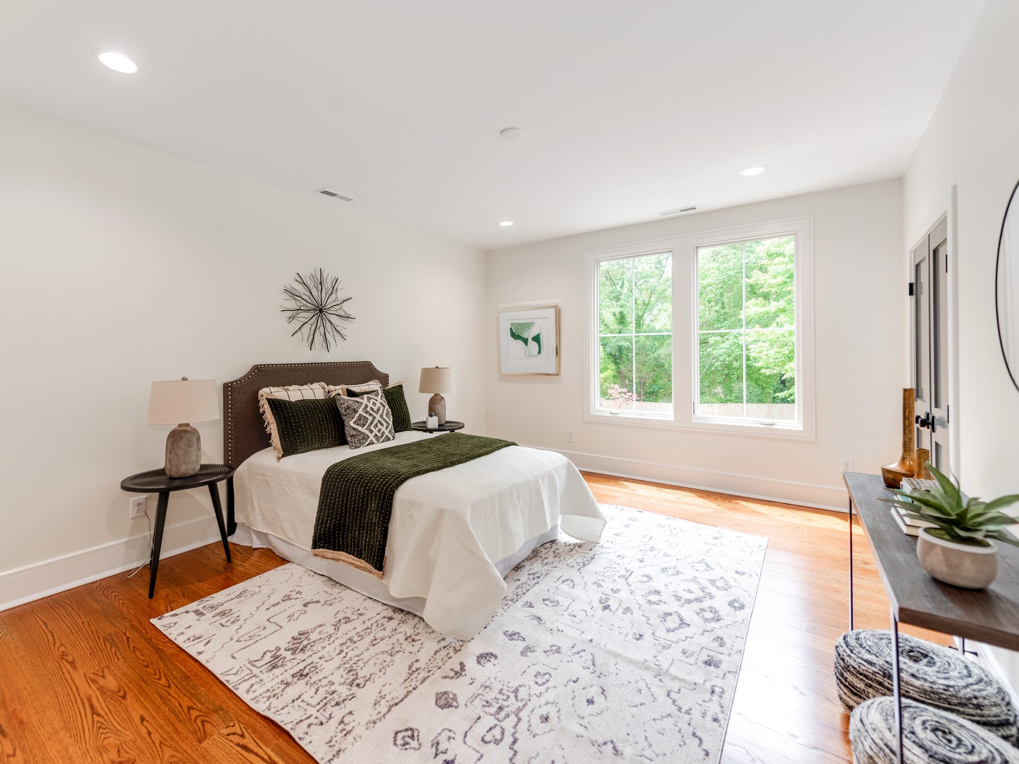 Guest bedroom with neutral palette and statement art — Brantham by Stillman Properties Charlotte NC