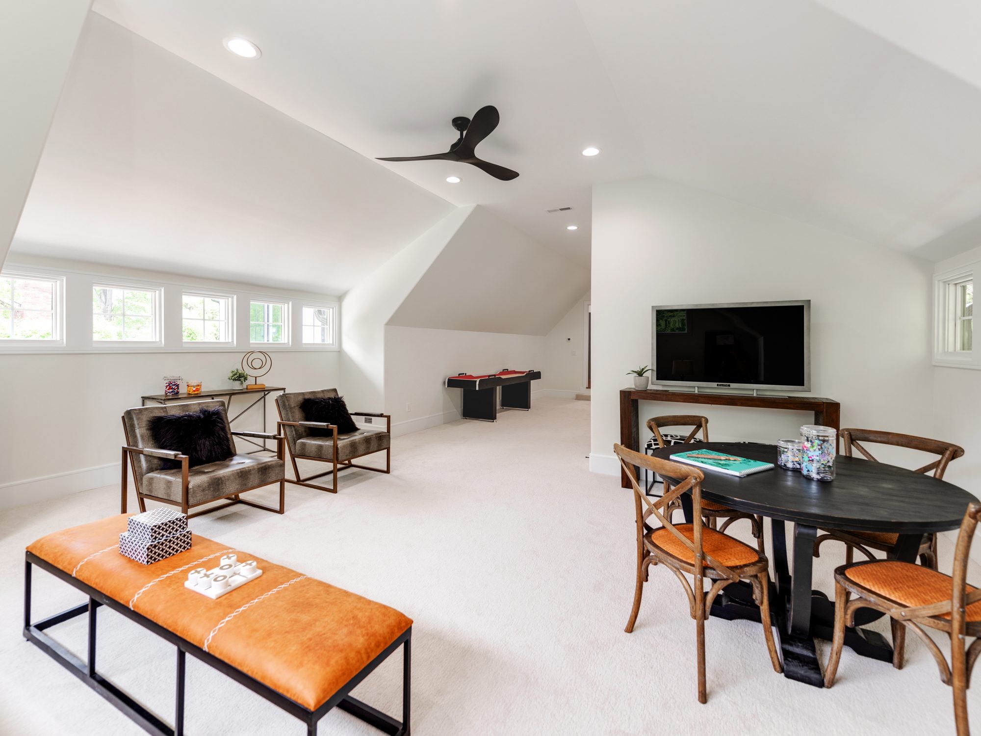 Bonus room sitting area with custom built-in desk and television — Brantham by Stillman Properties Charlotte NC