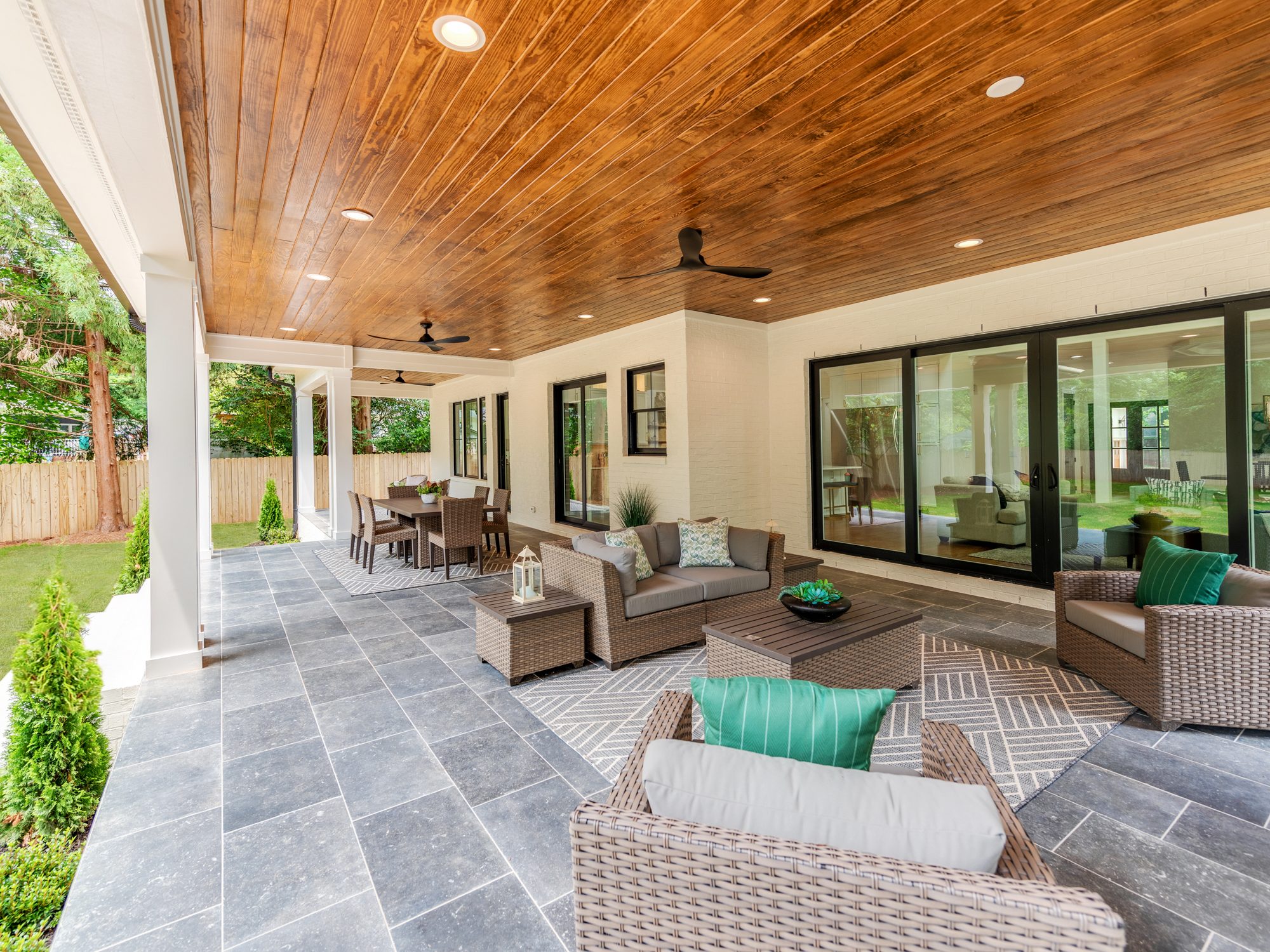 Covered outdoor living looking out to the backyard — Brantham by Stillman Properties Charlotte NC