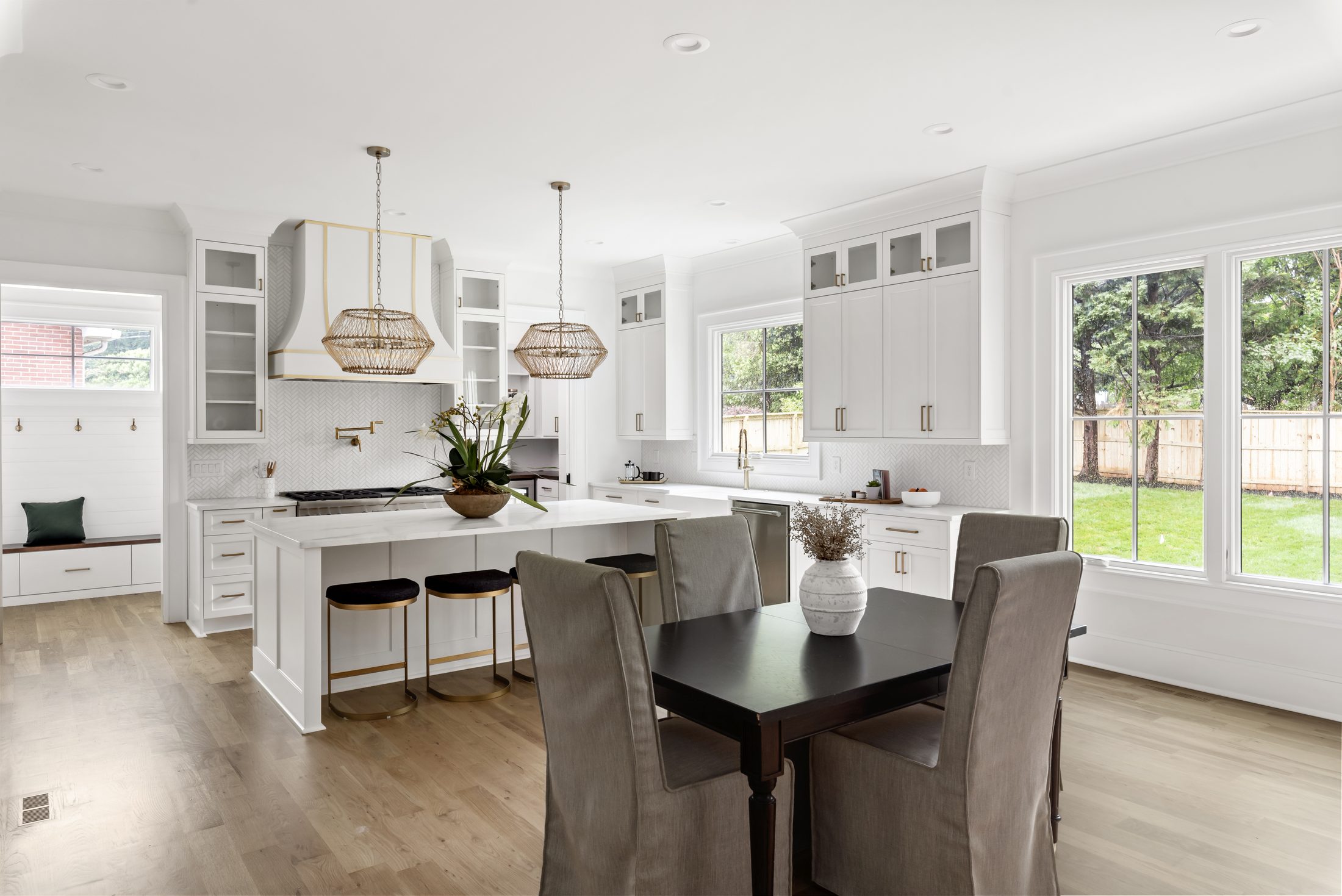 Great room with sliding glass doors fully open to the backyard — Bywood by Stillman Properties Charlotte NC