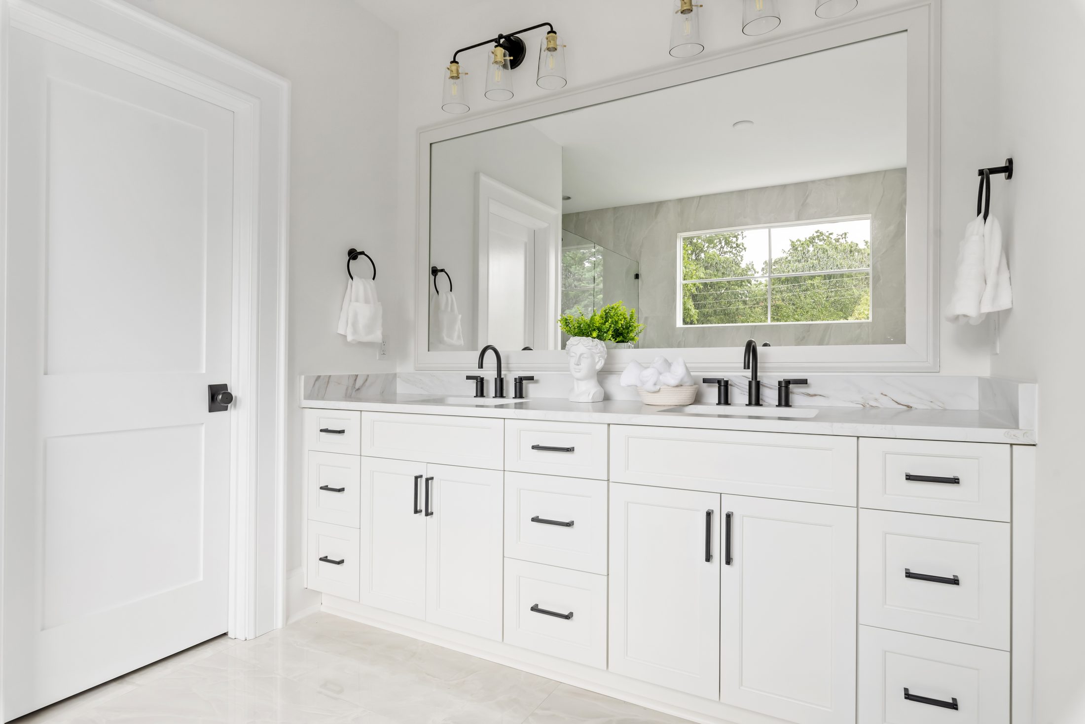 Primary bath double vanity with marble-look counter and black fixtures — Bywood by Stillman Properties Charlotte NC