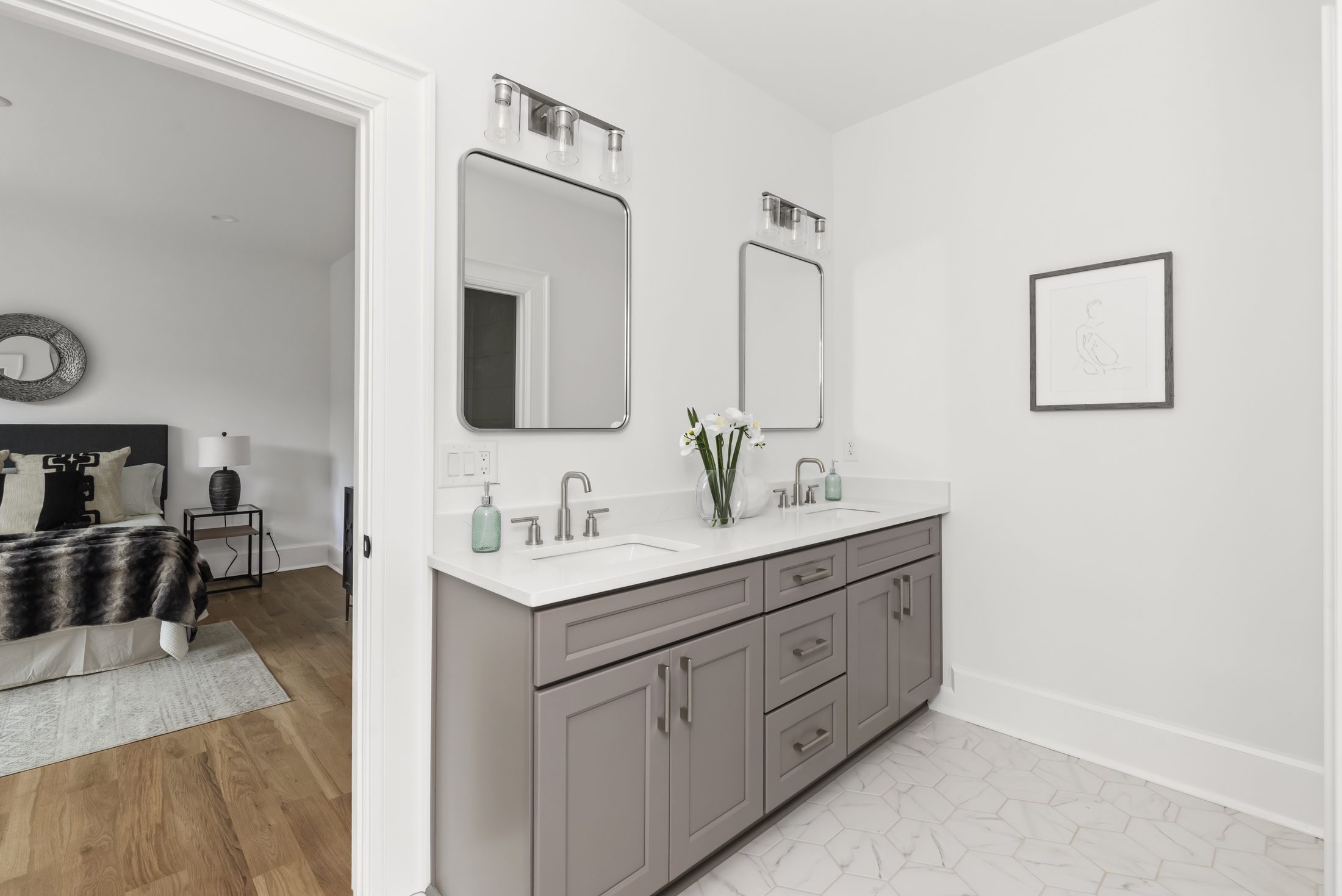 Jack-and-Jill bath with gray double vanity and brushed-nickel fixtures connecting two bedrooms — Bywood by Stillman Properties Charlotte NC