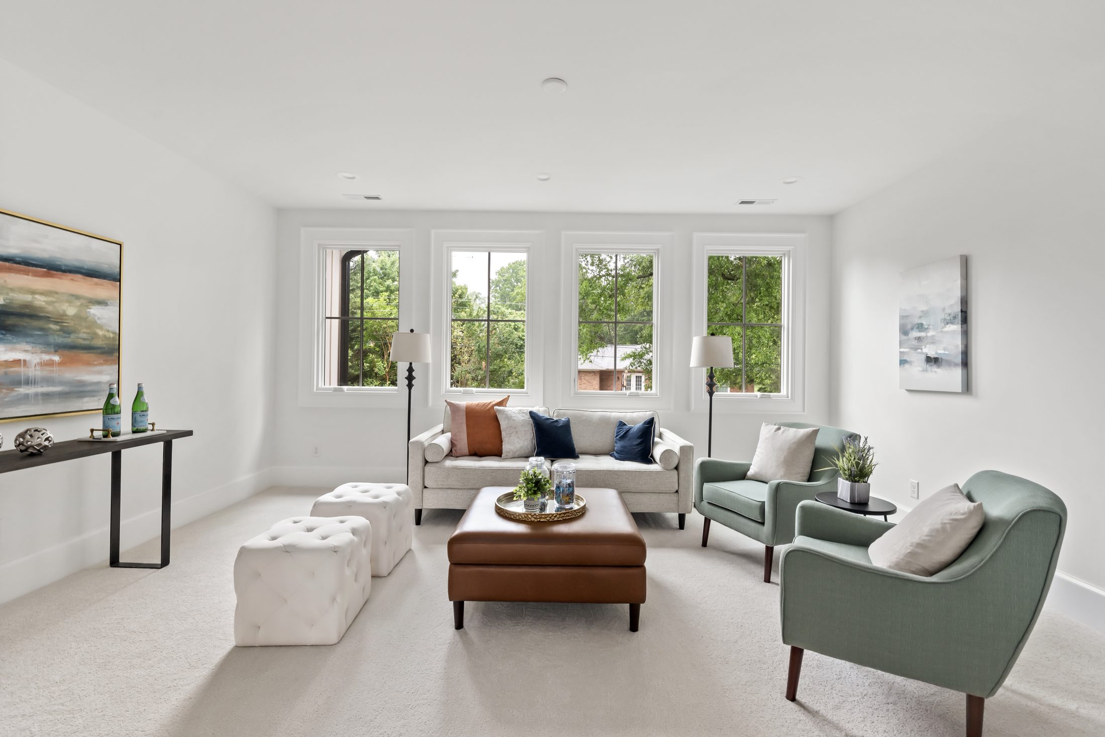 Loft sitting room with four-window exposure and flexible lounge seating — Bywood by Stillman Properties Charlotte NC