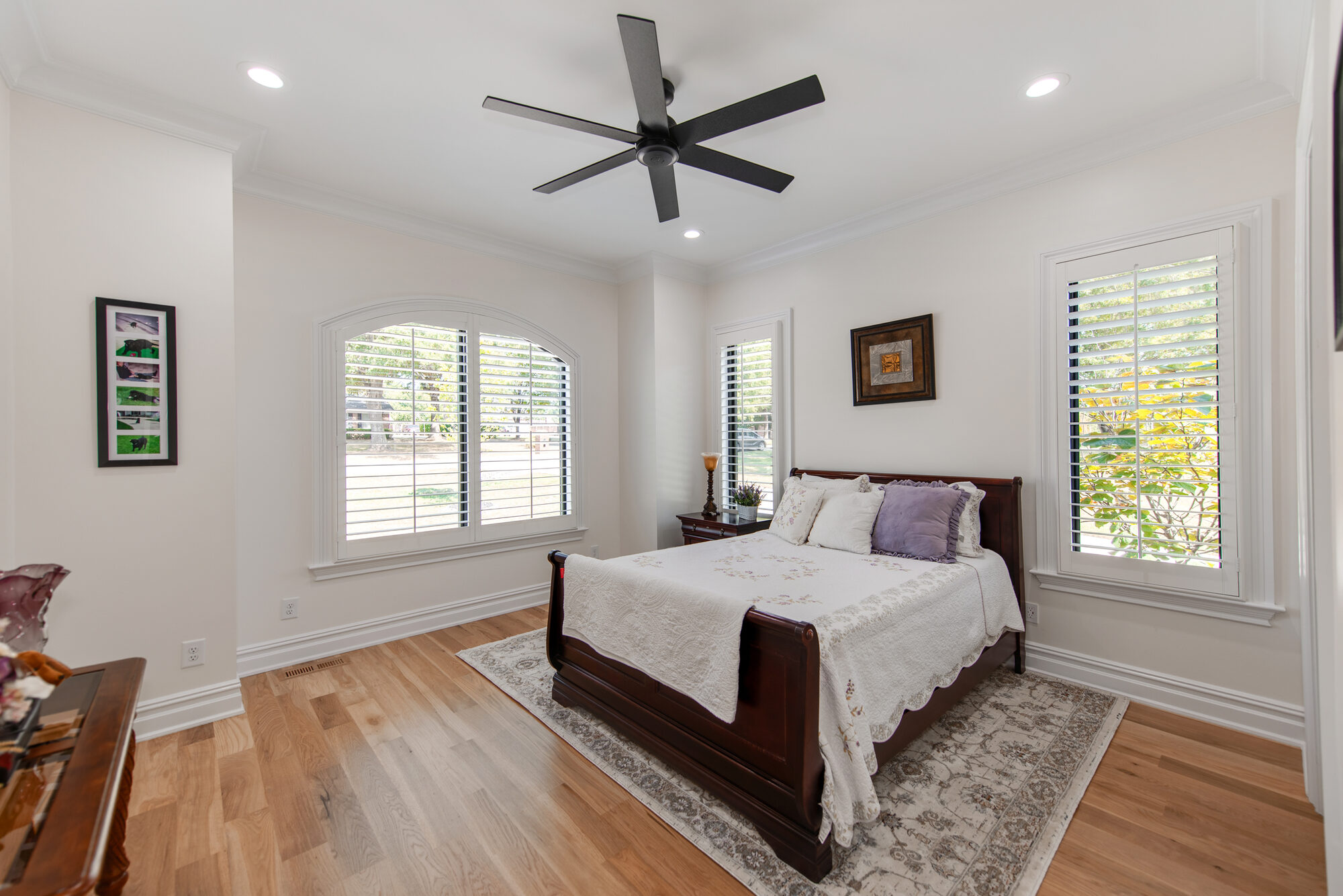 Guest suite with arched window and plantation shutters — Coddle Creek by Stillman Properties Concord NC