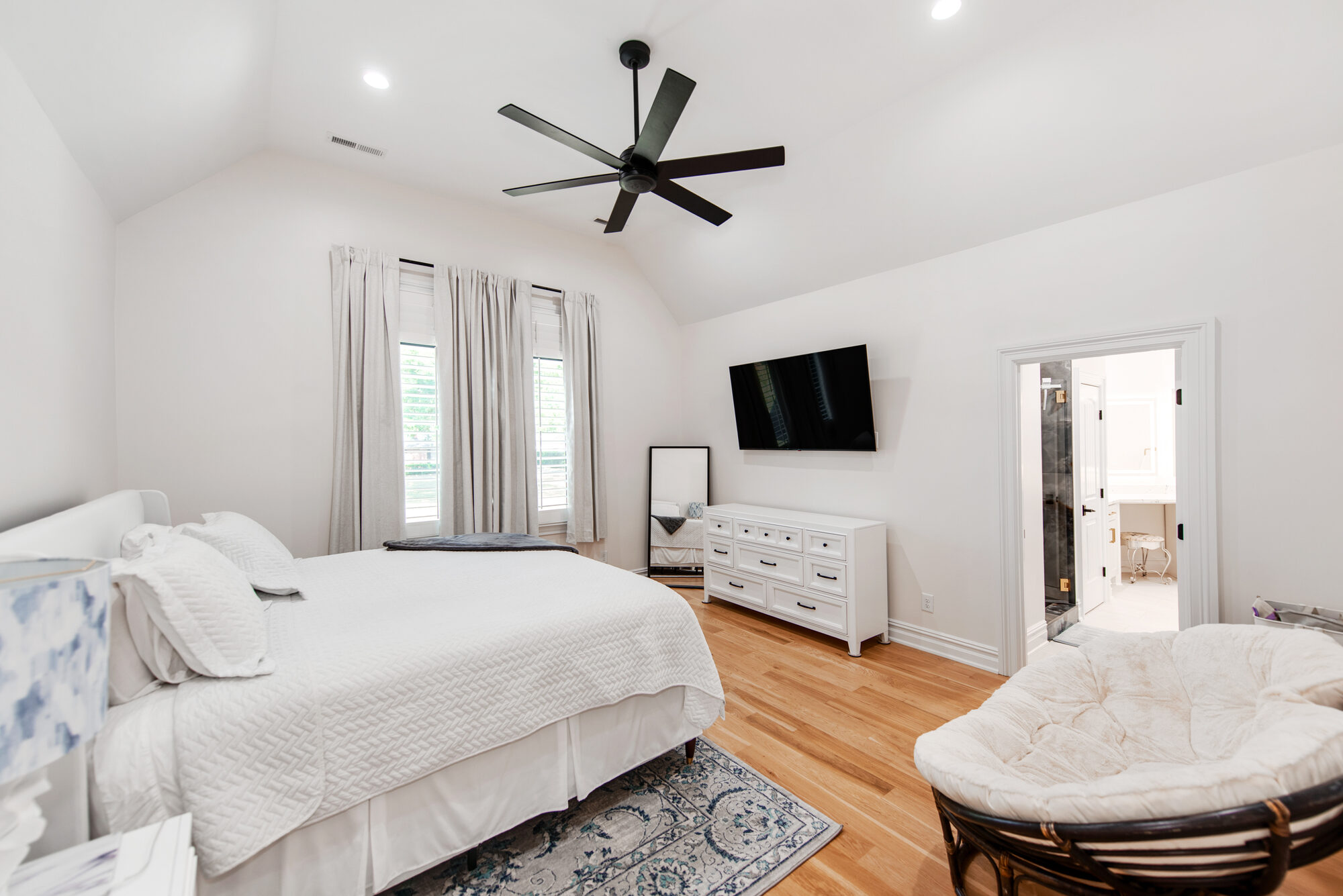 Guest suite with vaulted ceiling and en-suite glimpse — Coddle Creek by Stillman Properties Concord NC