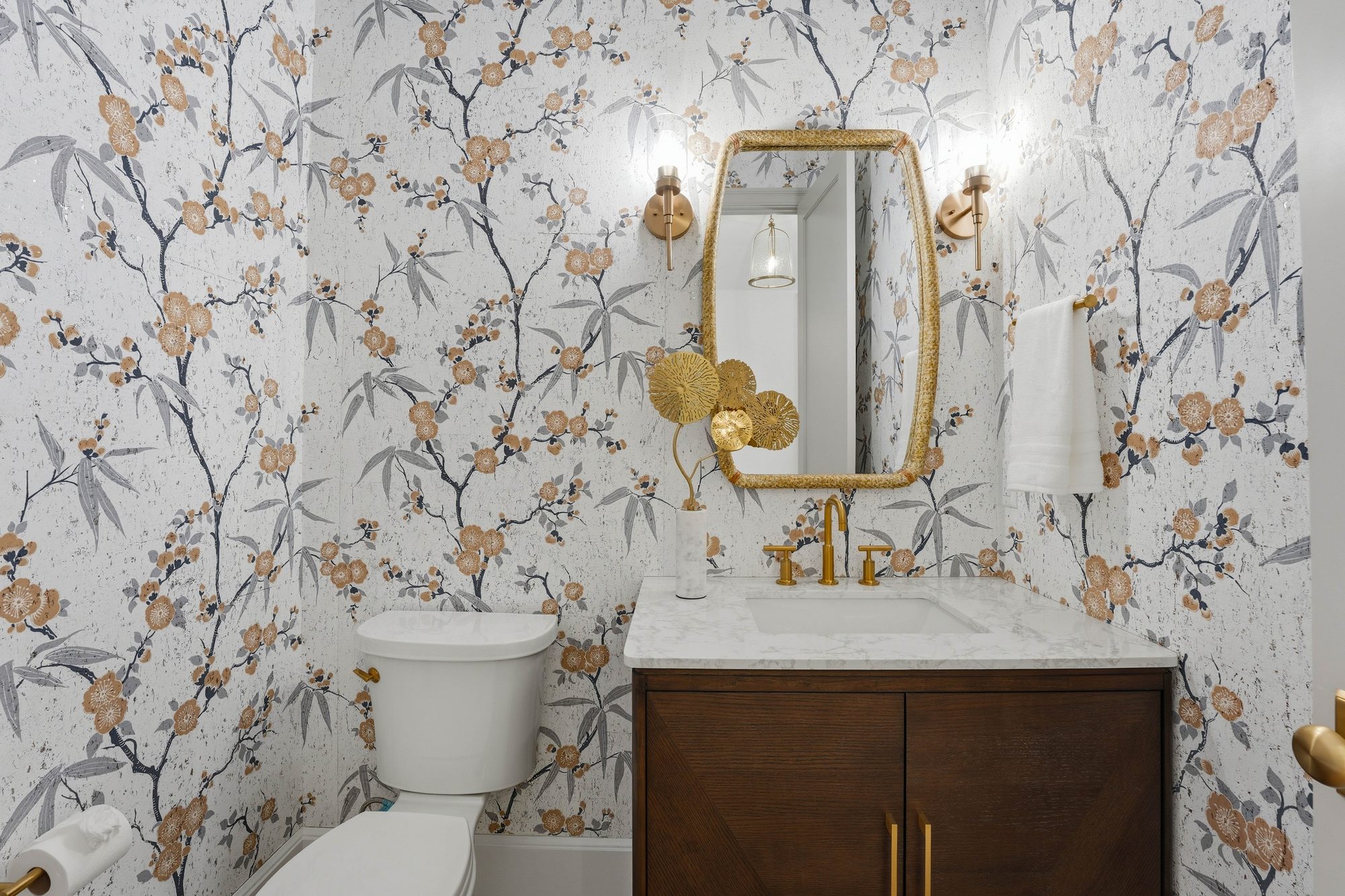 Powder bath with chinoiserie wallpaper, brass fixtures, and capiz shell light — Creola custom home in Charlotte NC by Stillman Properties