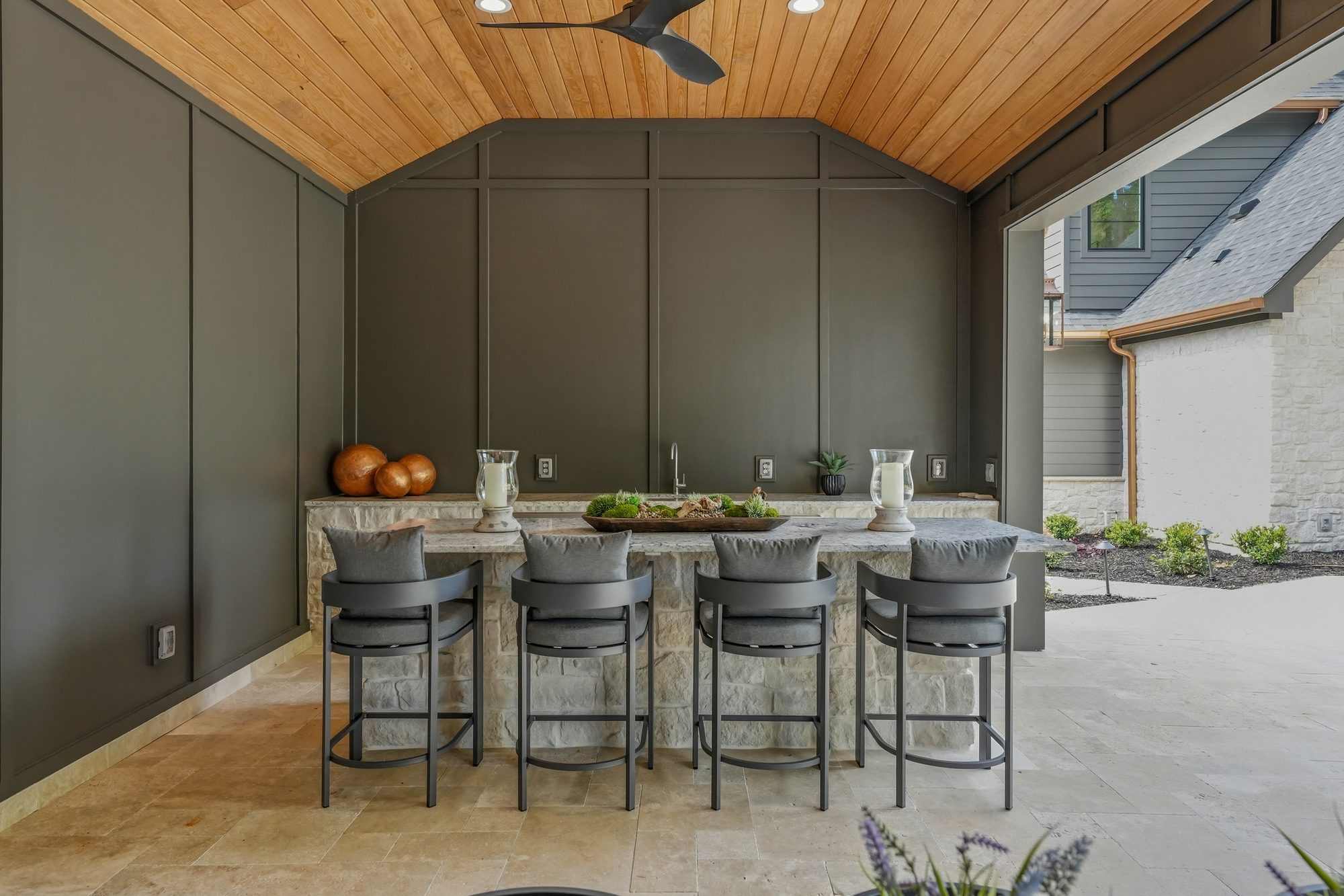 Pool cabana stone island with bar stools and prep counter — Creola custom home in Charlotte NC by Stillman Properties