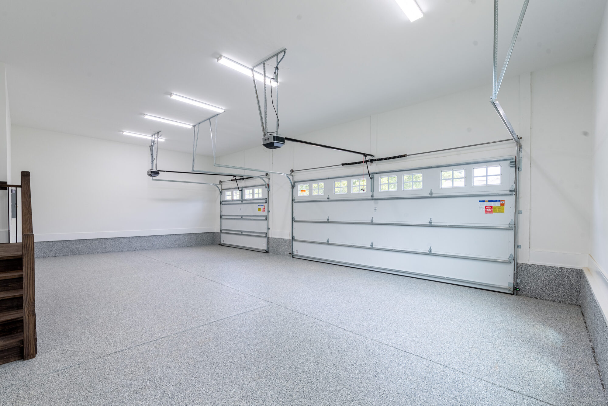 Walker garage interior with epoxy speckle floor and clean white walls — Stillman Properties Cotswold Charlotte NC