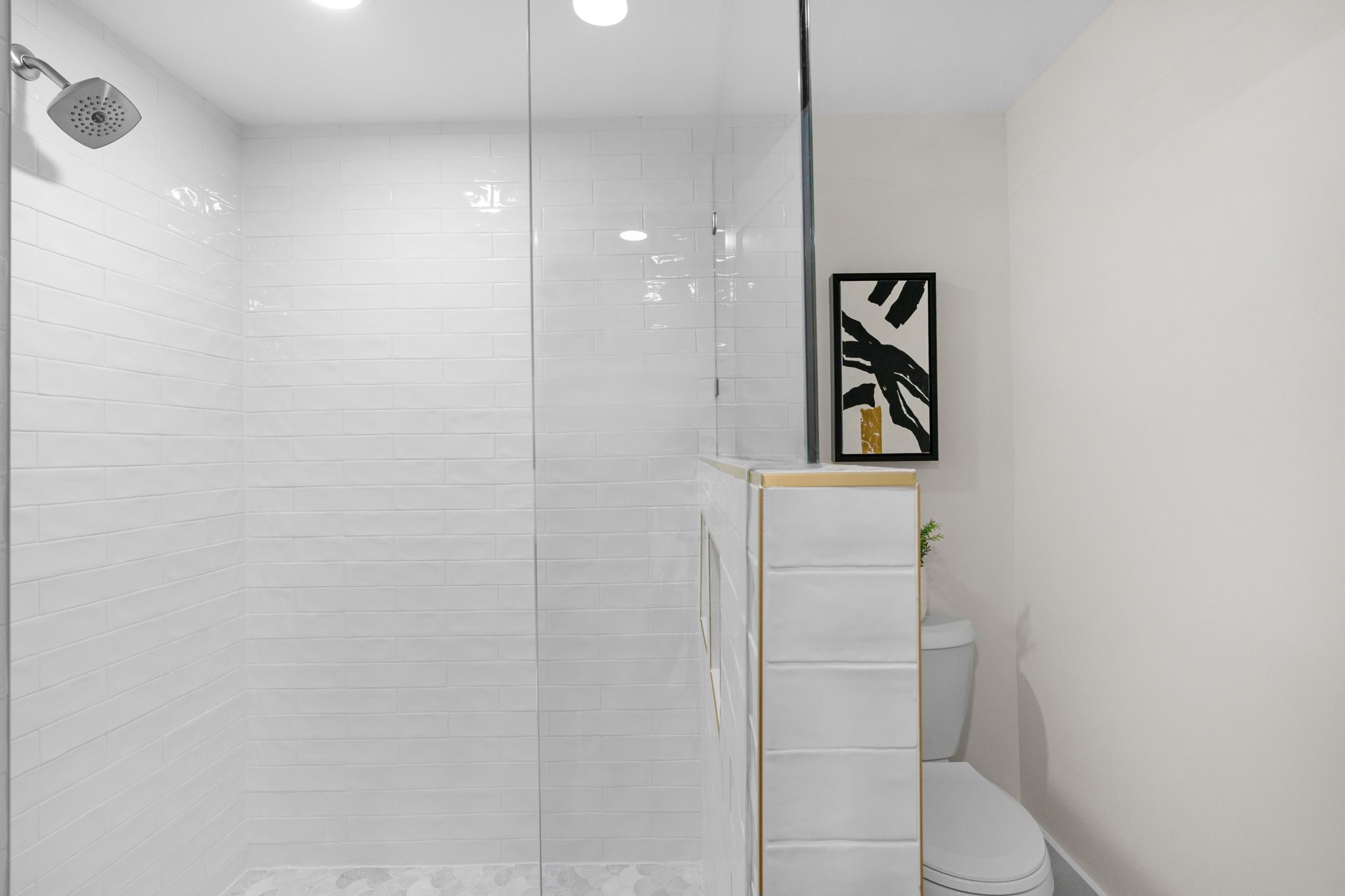 Lower-level bath walk-in shower with tile surround — Wyanoke by Stillman Properties Charlotte NC