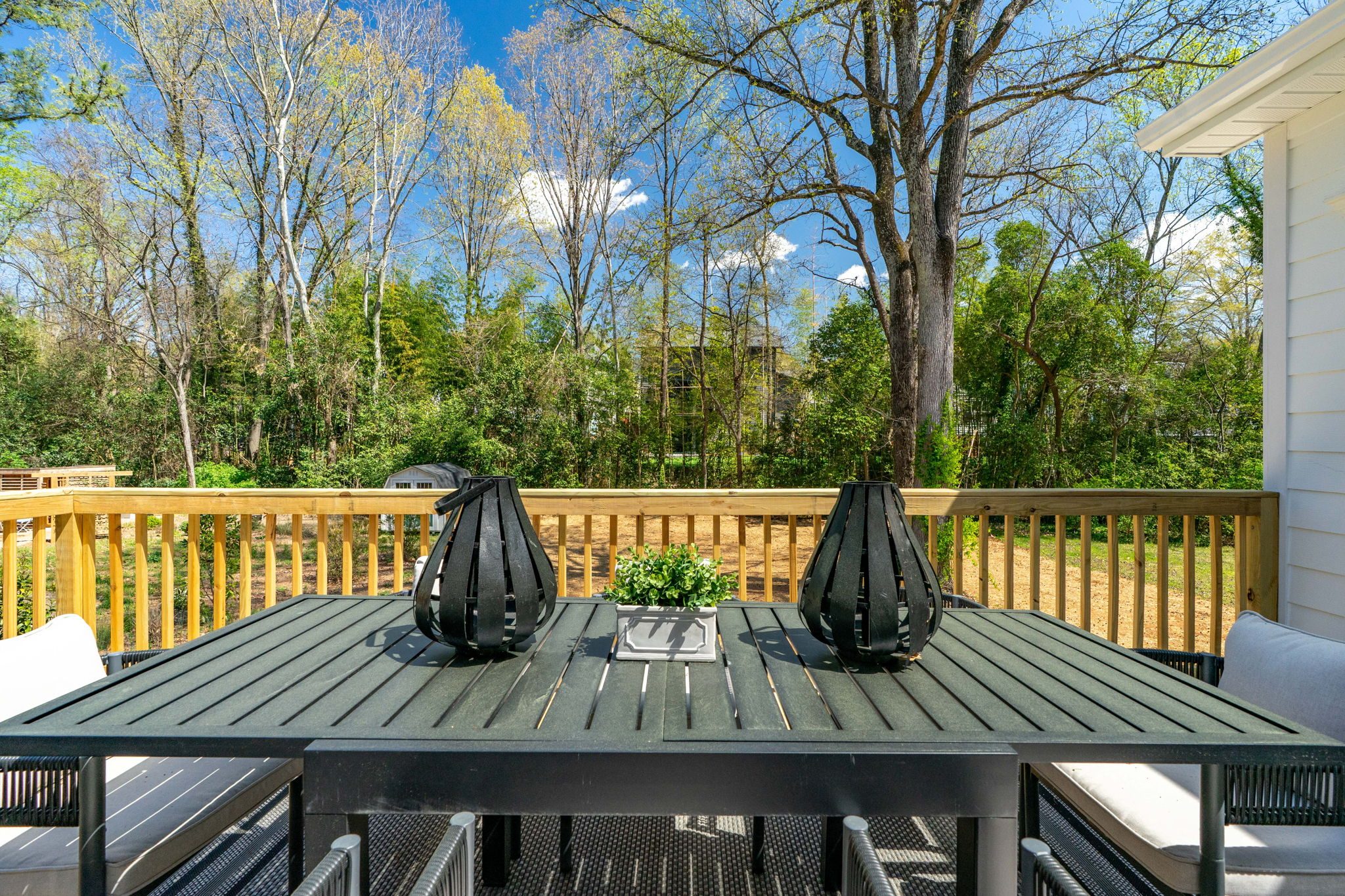 Rear deck with outdoor dining set — Wyanoke by Stillman Properties Charlotte NC