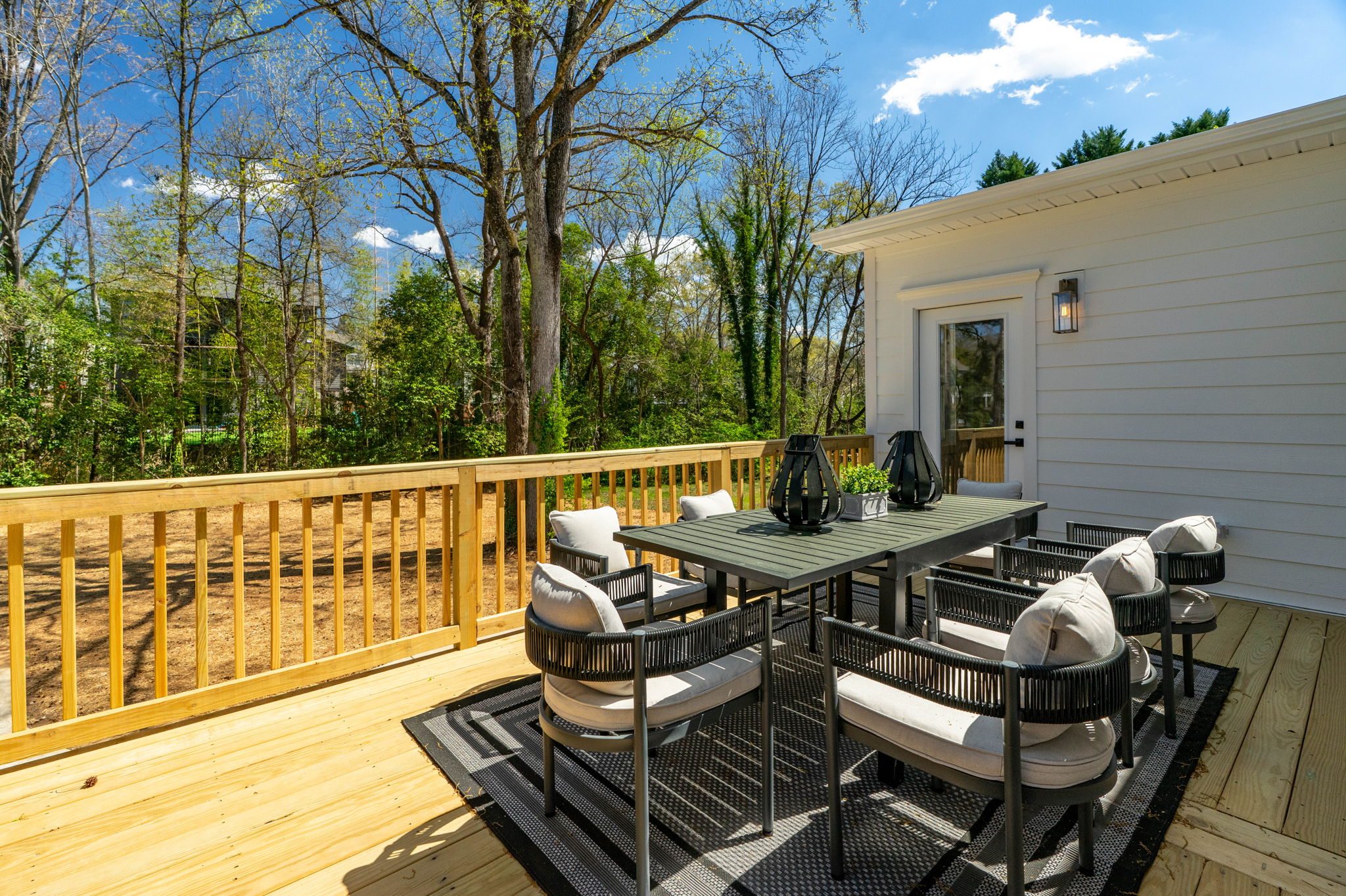 Rear deck lounge seating beside the home — Wyanoke by Stillman Properties Charlotte NC