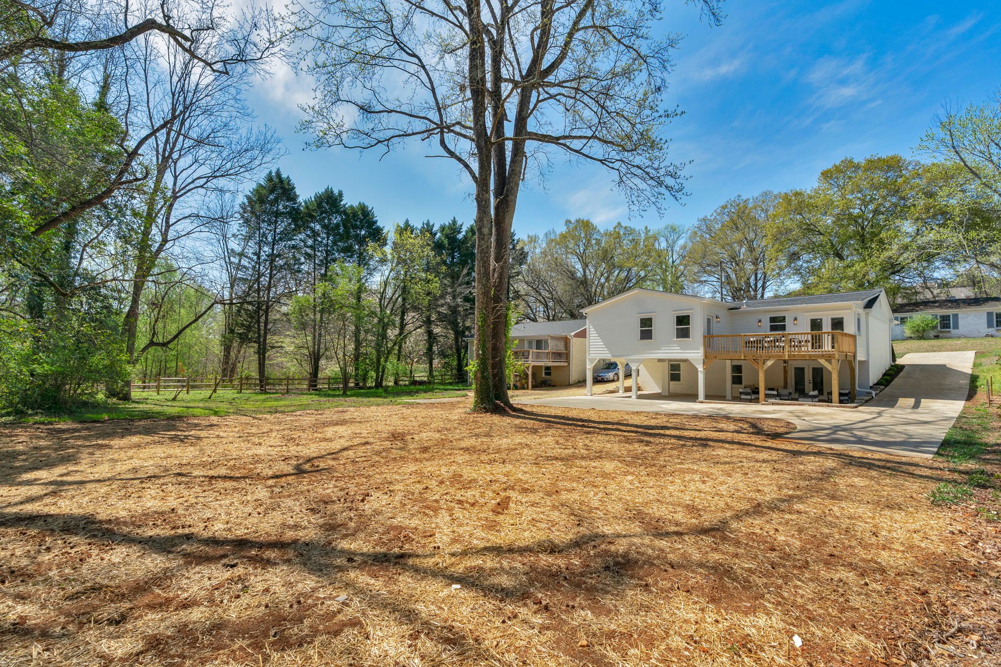 Wide view of the Wyanoke lot showing the home, pavilion, and grounds — Stillman Properties Charlotte NC