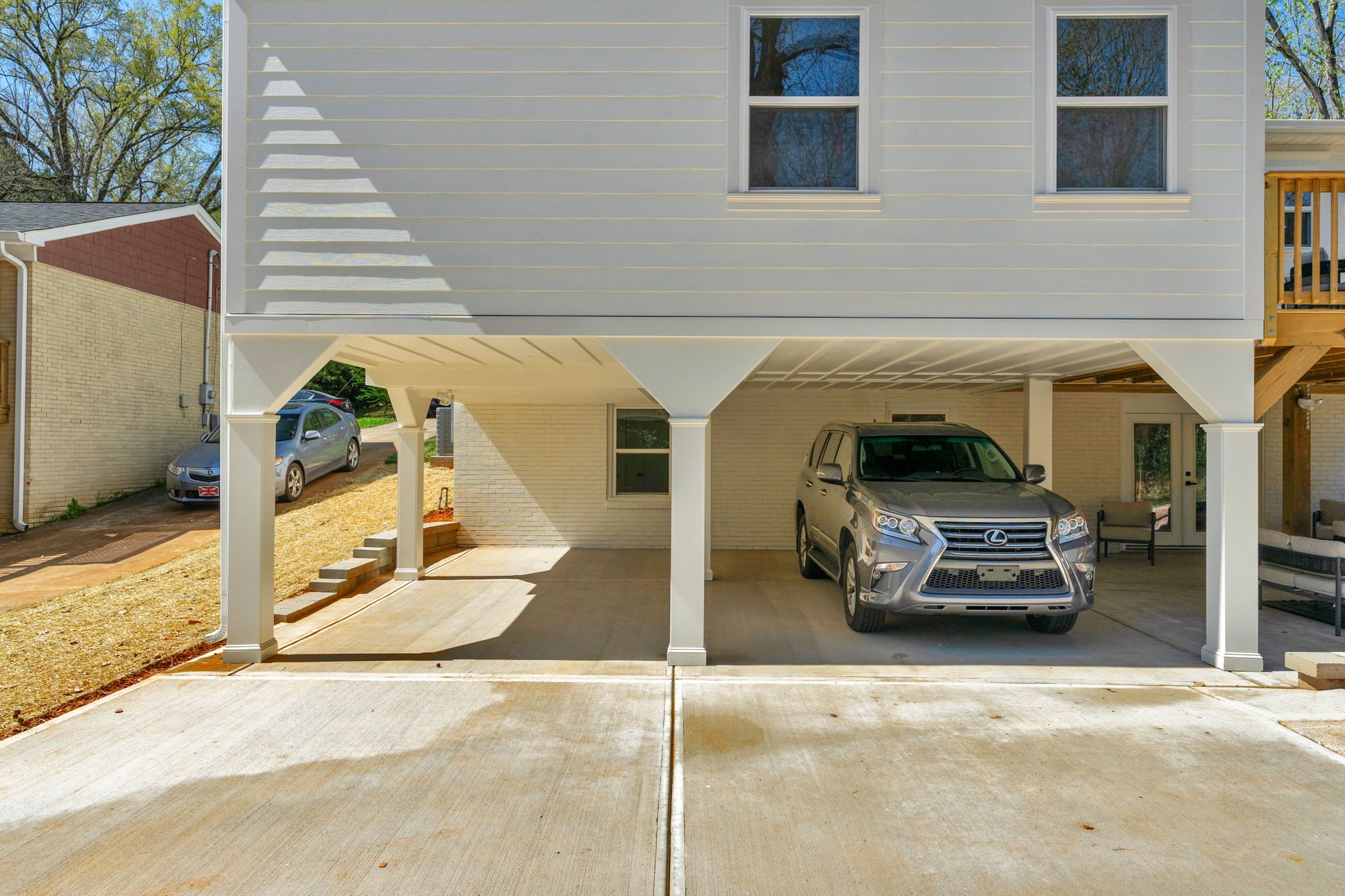 Covered carport with new concrete drive — Wyanoke by Stillman Properties Charlotte NC